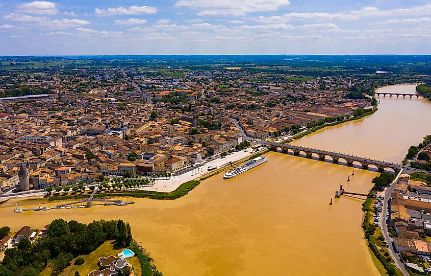 Panoramic aerial view of Libourne city on Dordogne river on sunny summer day, Gironde, France