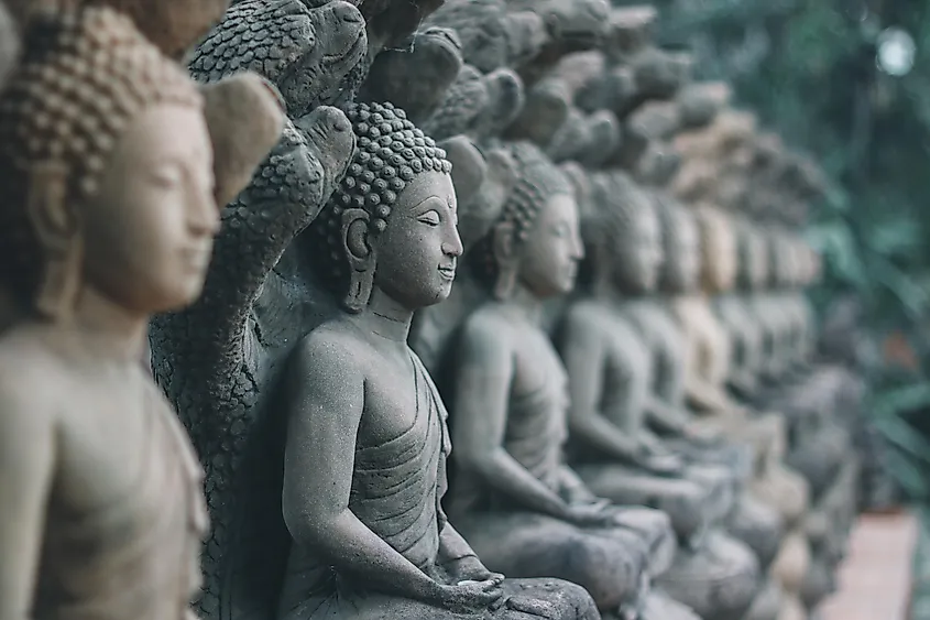 Rock Buddha statue with sunlight used for amulets of Buddhism religion. Buddhism is popular region in Thailand and south east Asia.