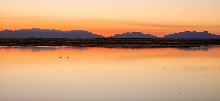 A scenic sunset view of Lake Holloman in New Mexico.