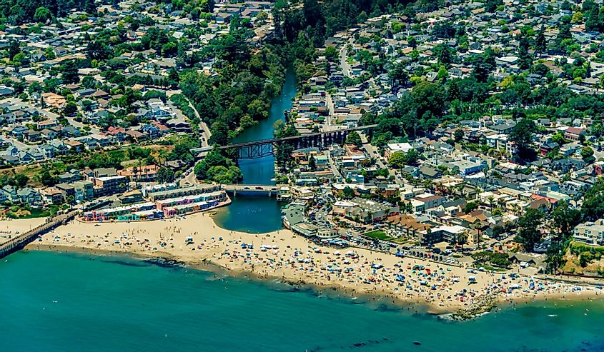 The aerial view of the beach with tourists in the city of Capitola in Northern California, close to the city of Santa Cruz.