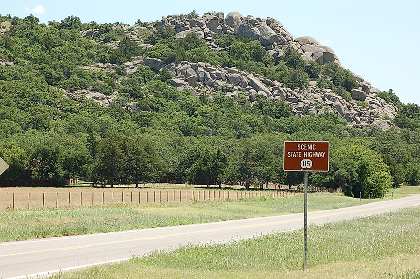 Scenic State Highway 115 sign marking the Wichita Mountain Byway along the northern edge of the mountain range