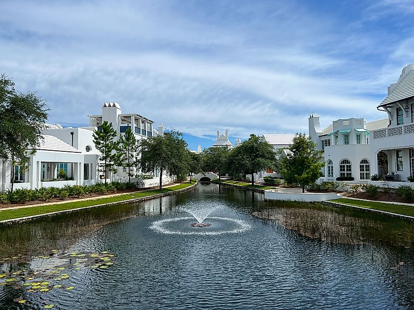 A walking path with water features and homes in Alys Beach, Florida.