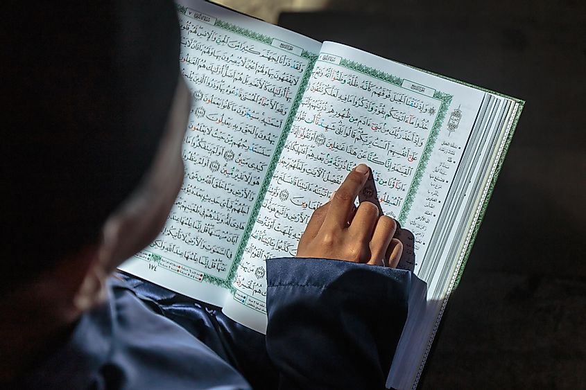A Muslim kid reading the Quran