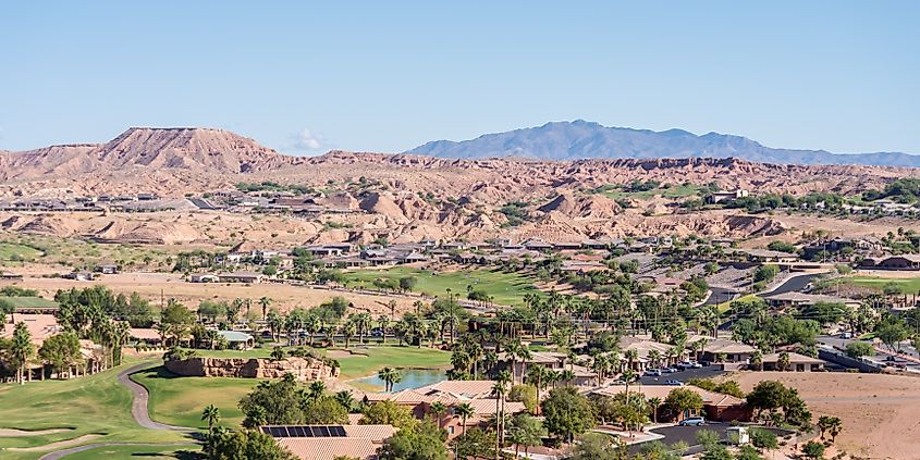 Mesquite, Nevada, picturesquely nestled in a valley surrounded by mesas and mountains, showcasing the town's stunning natural backdrop.