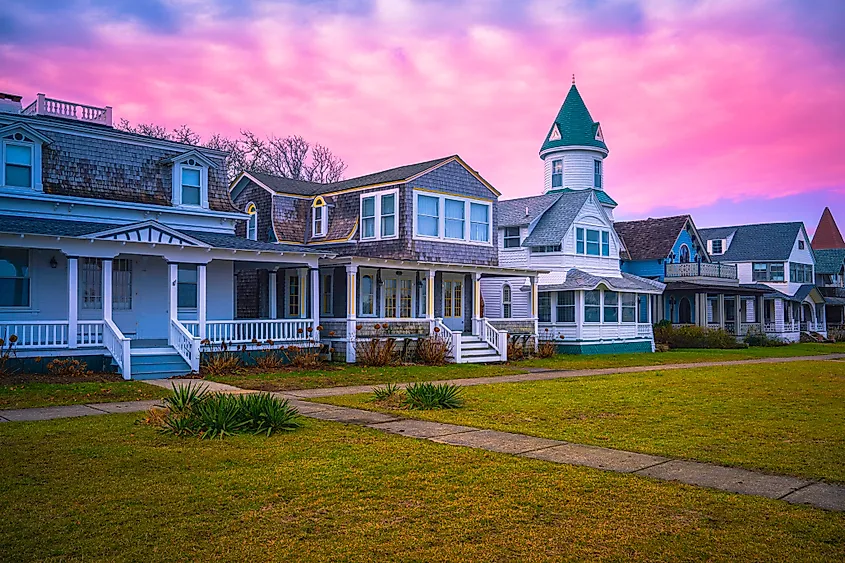 Oak Bluffs sunset skyline with well-preserved landmark houses and dramatic pink winter cloudscape over Ocean Park on the island of Martha's Vineyard in Dukes County, Massachusetts, United States. Via Shutterstock / Naya Dadara