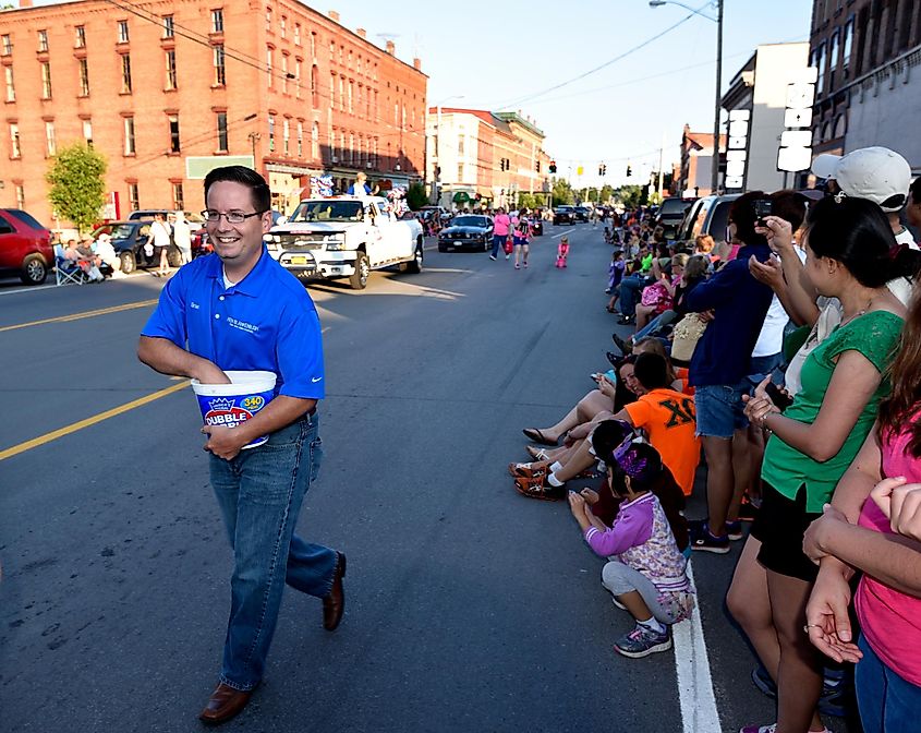 Brian Peck walks in the Lewis County fair parade on July 21, 2015 in Lowville New York, via North woodsman / Shutterstock.com