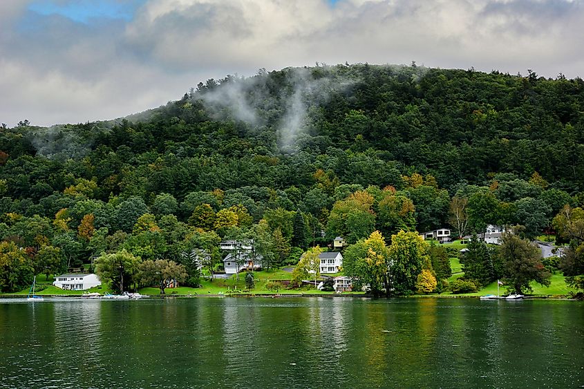 Homes along the shore of Ostego Lake, in Cooperstown, New York. Editorial credit: Steve Cukrov / Shutterstock.com