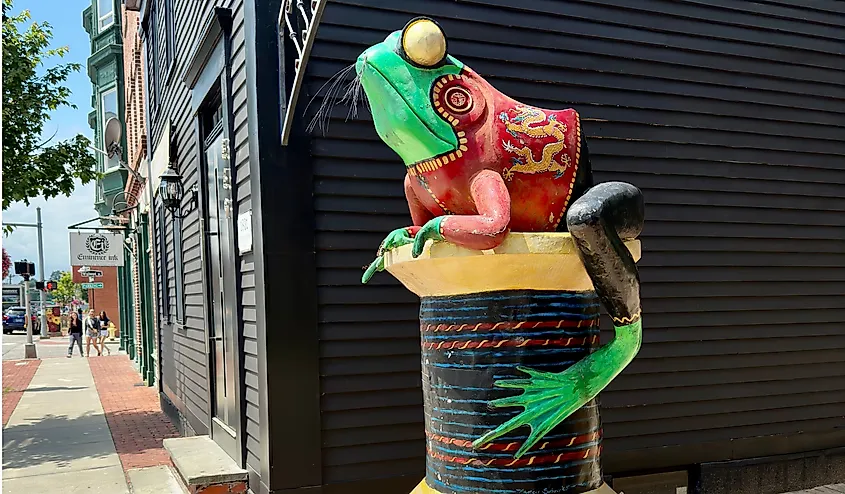 Frog statue sitting on a spool of thread in Willimantic, Connecticut, USA.