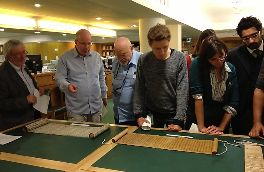 Manichaean scholars studying two Chinese scrolls: the Manichaean Hymn Scroll (Or.8210/S.2659) on the left and the Compendium of the Teachings of Mani, the Buddha of Light (Or.8210/S.3969) on the right, dating back to AD 731. Image taken at the British Library.