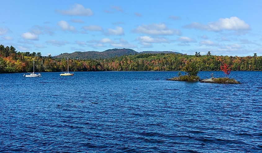 Boats on Umbagog Lake in New Hampshire with blue sky