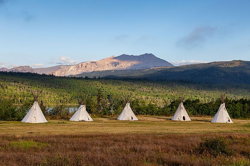 Native American Tipis in a field in Montana near Glacier National Park.