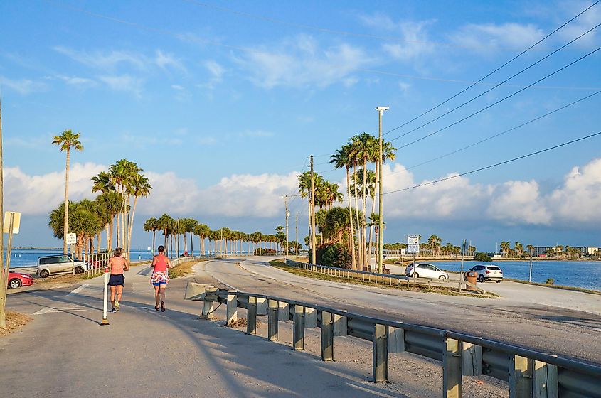People jogging in the morning at Dunedin Causeway near the beach in Dunedin, Florida