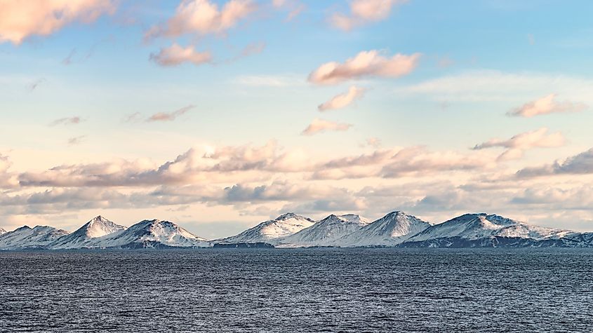 Snow peaks, glaciers and rocks of Aleutian Islands