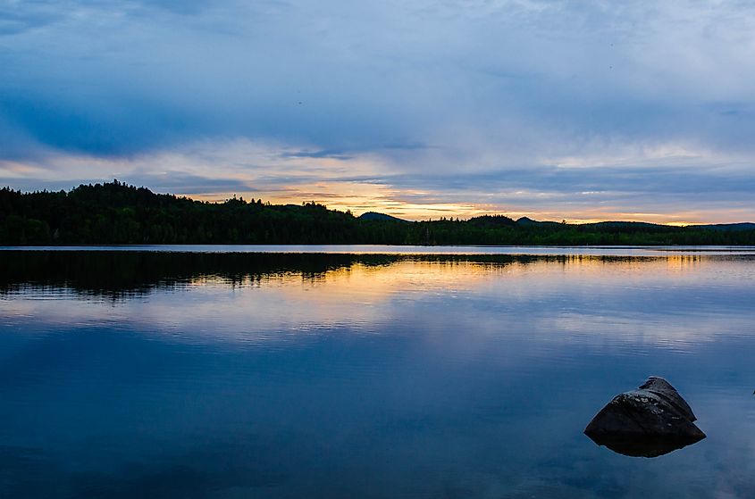 A lonely rock sits in Allagash Lake along the Allagash Wilderness Waterways in Maine.