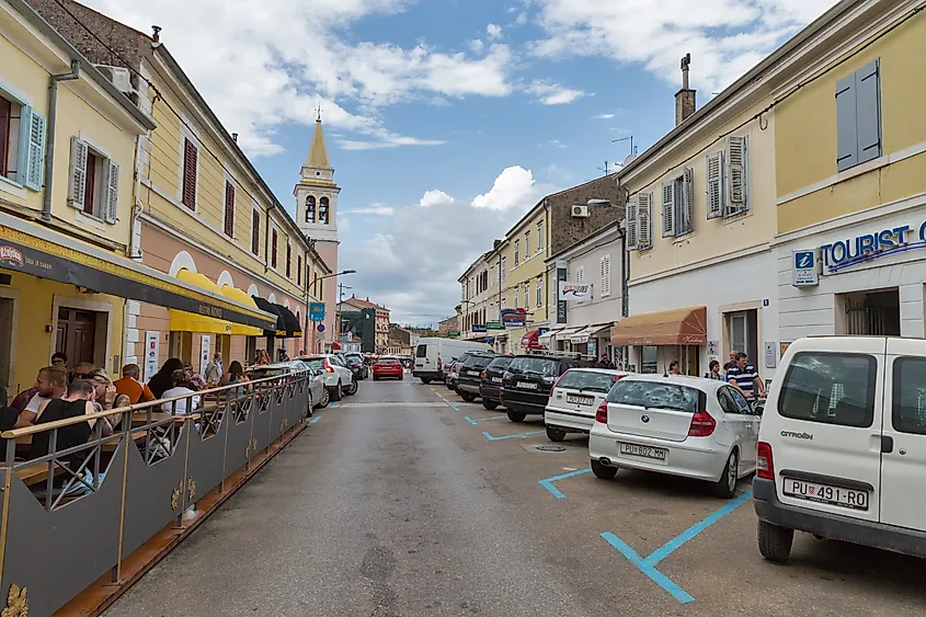 People walk along Zagreb street, Poreč, Croatia.
