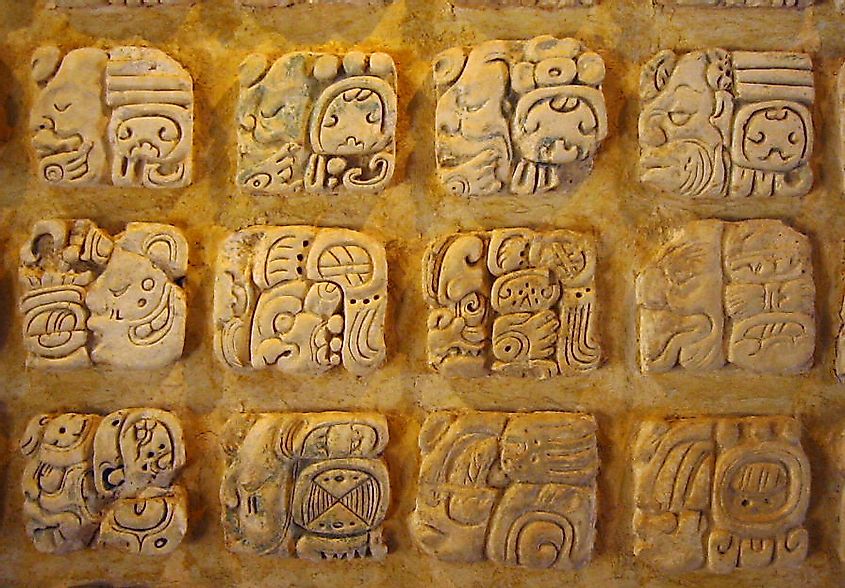 Classic period Maya glyphs in stucco at the Museo de sitio in Palenque, Mexico