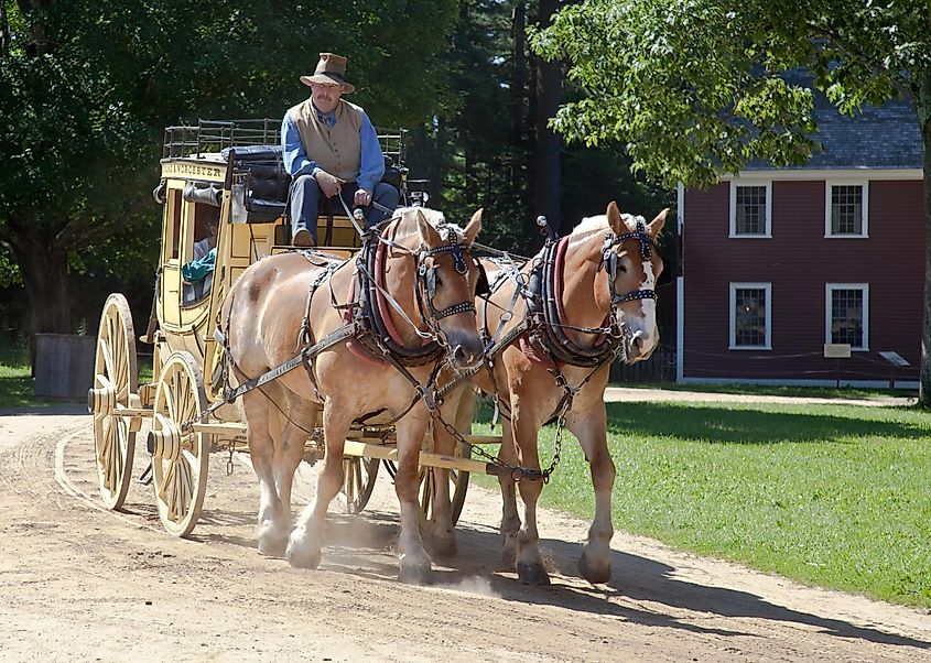 Period actor recreates a stage wagon ride for visitors on in Old Sturbridge Village, MA. Editorial credit: Jeff Schultes / Shutterstock.com