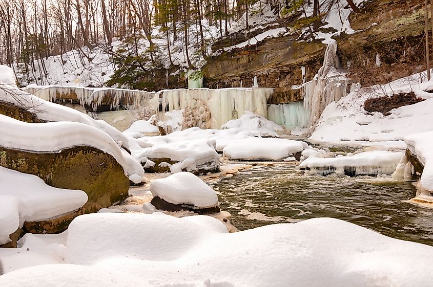 The iced-over Great Falls of Bedford Ohio seen from downstream at creekside.
