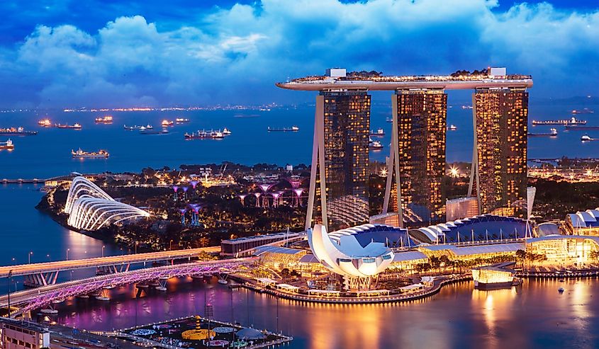 Landscape of Singapore business building around Marina bay. Modern high building in business district area at twilight.