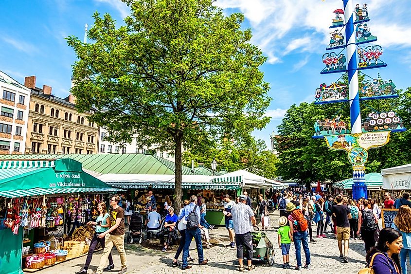 View of people walking in Viktualienmarkt in Munich a sunny day.