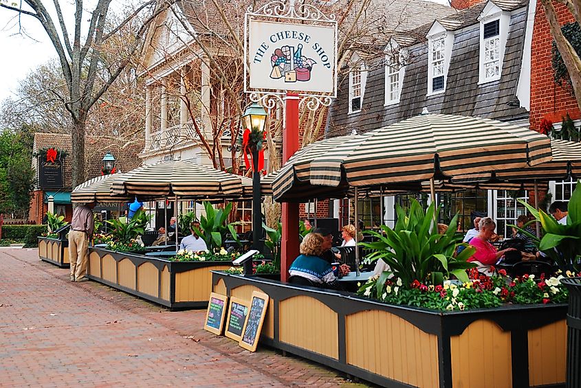 Folks enjoy an alfresco meal in Merchants Square, a retail and dining area near Colonial Williamsburg, Virginia, via James Kirkikis / Shutterstock.com