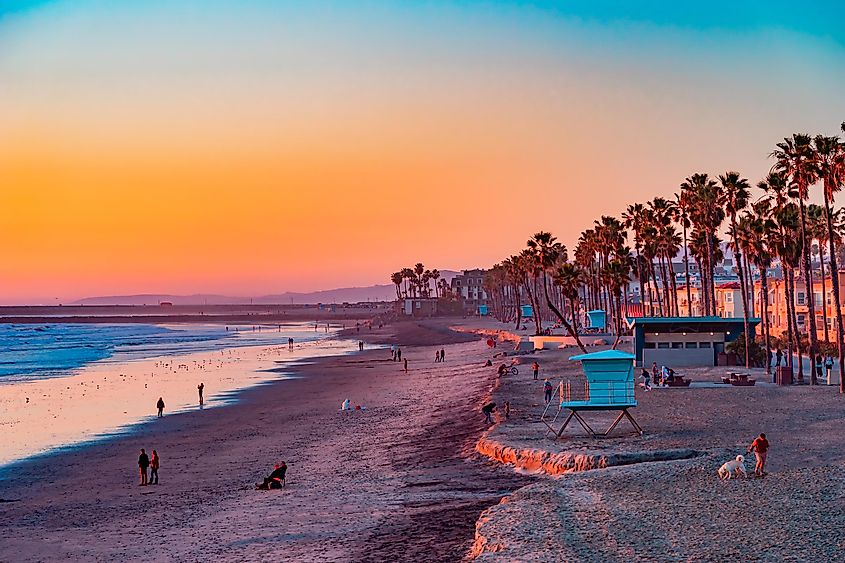 View of the beach from the pier at sunset, in Oceanside, California.