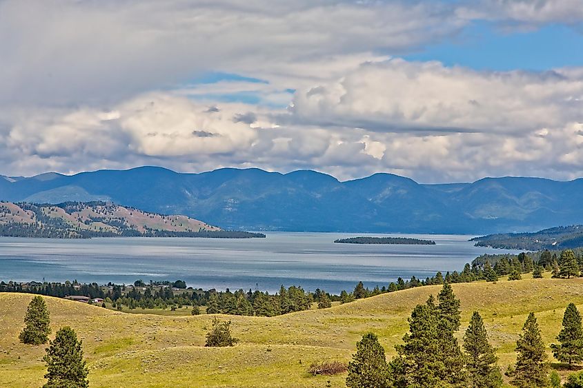 A scenic view of Flathead Lake from Polson,MT.with clouds over the mountains in the background