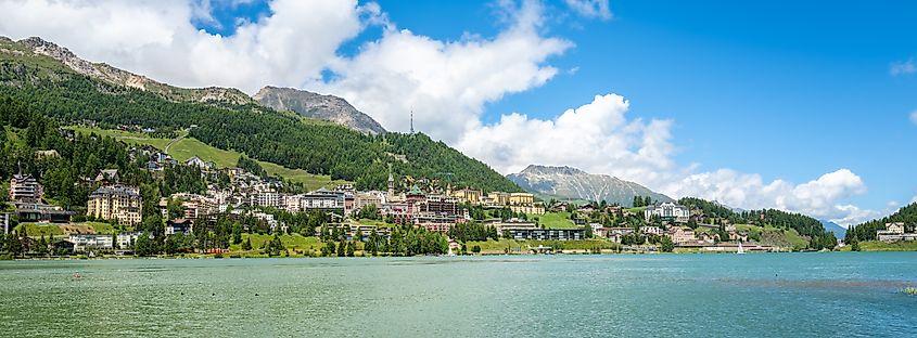  Tranquil panorama of lakeside town of Sankt Moritz with mountains.