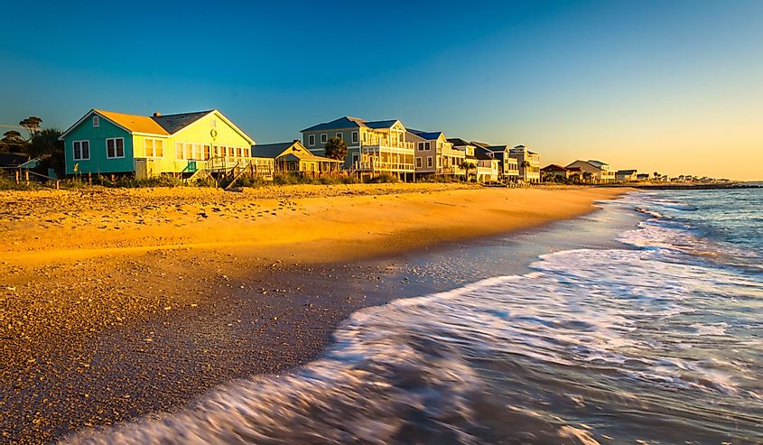Waves in the Atlantic Ocean and morning light on beachfront homes at Edisto Beach, South Carolina