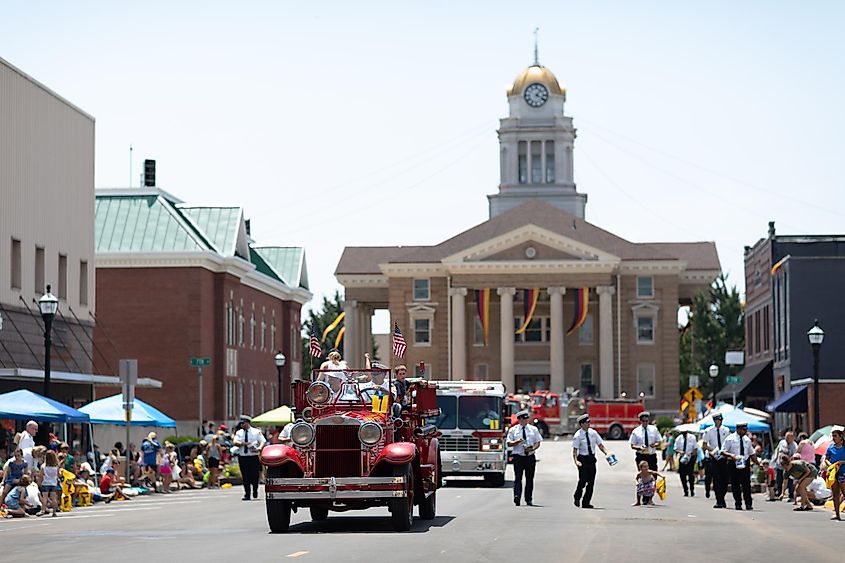 People in a parade in Jasper, Indiana, via Roberto Galan / Shutterstock.com