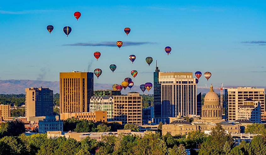 Capital and skyline of Boise Idaho with balloons in flight