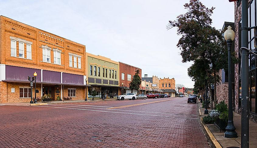 View of downtown Nacogdoches, brick covered streets and old historic buildings