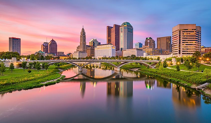 Columbus, Ohio, USA skyline on the river at dusk.