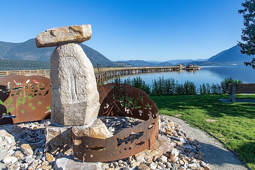 Close up of the rock and metal Secwépemc Landmarks Sculpture at the entrance to Salmon Arm wharf.
