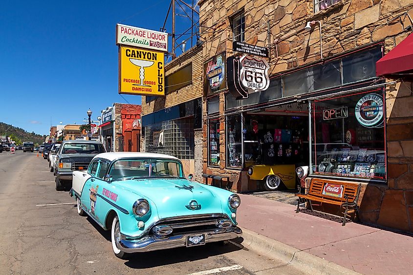 Street scene with classic car in front of souvenir shops in Williams, Arizona.