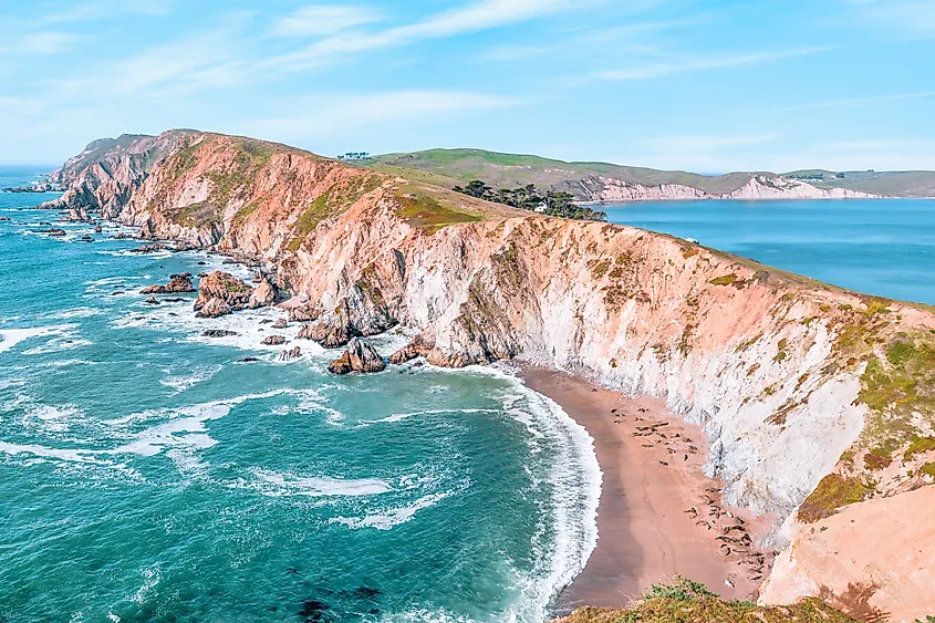 Point Reyes, California, with dramatic coastal cliffs surrounded by the Pacific Ocean.
