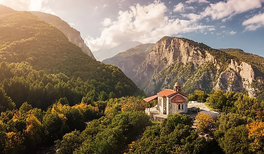 Aerial drone panoramic view of a little church on a cliff in deep canyon near legendary Mountain Olympus