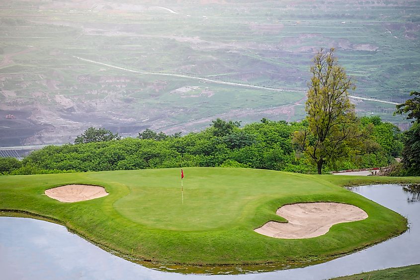 A fairway leads to a green on the golf course at the Interlachen Country Club. Edina, Minnesota.