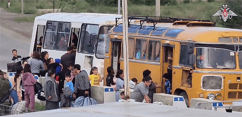 Russian peacekeepers assisting ethnic Armenian refugees evacuating Stepanakert in Nagorno-Karabakh.