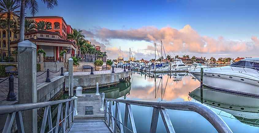 Sunrise over the boats in Esplanade Harbor Marina in Marco Island, Florida