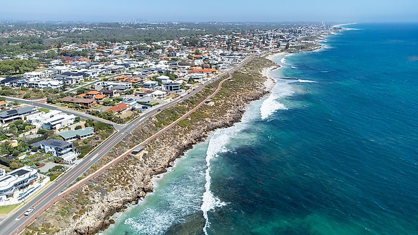 Coastal cliffs between Marmion and Sorrento, Western Australia, with homes overlooking the sea and views south toward Perth