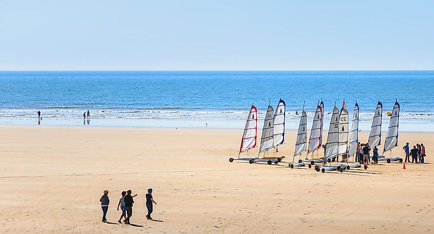 People sand yachting along the beach in Saint-Jean-de-Monts, France.
