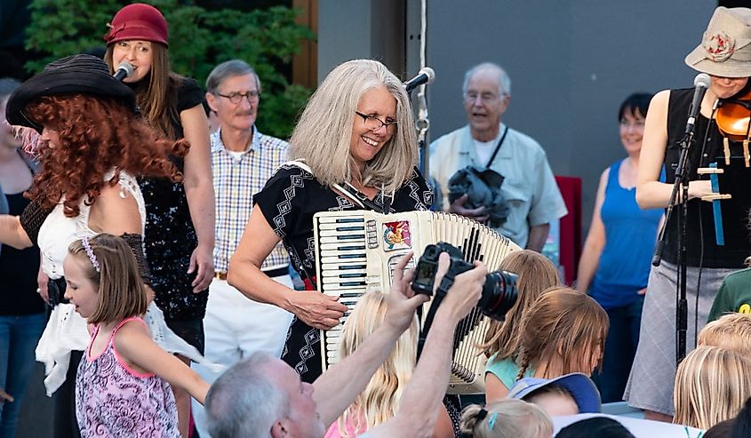 Stephany Smith Pearson of the Bathtub Gin Serenaders performs for the free, outdoor "Green Show," held six nights a week at the Oregon Shakespeare Festival.