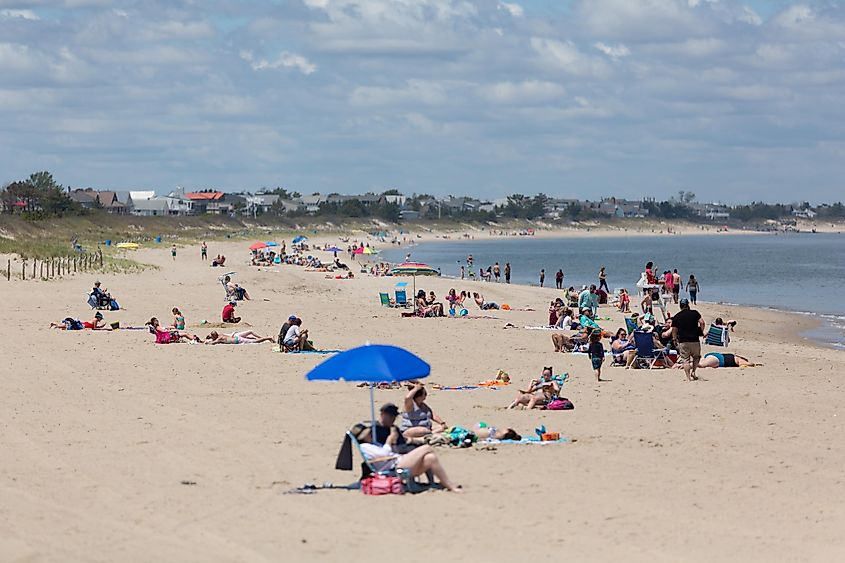 People enjoying their time at Lewes Beach, Delaware, via Brian Doty / Shutterstock.com