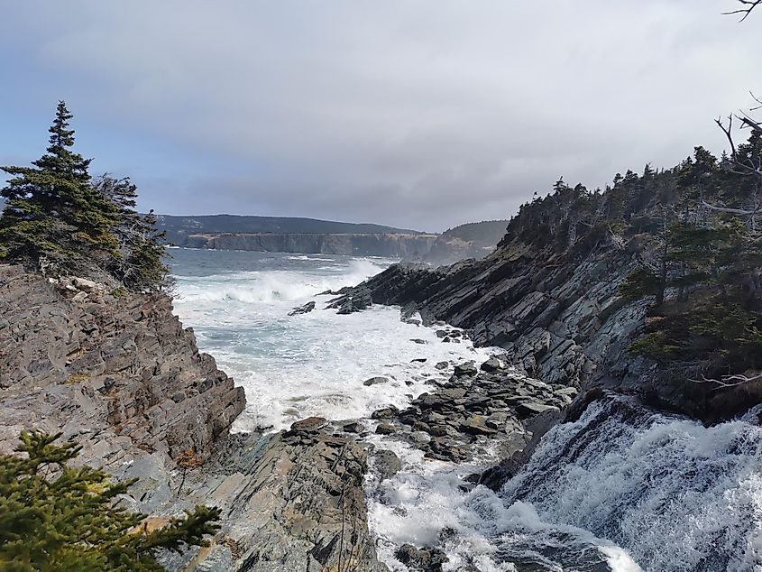 Ocean waves crashing in through a rocky inlet