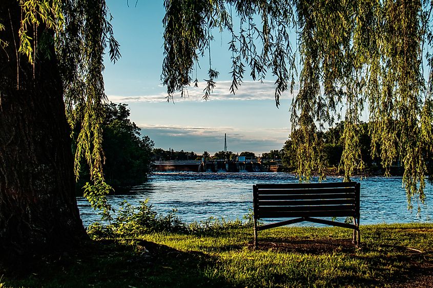 A park bench along the Mississippi River in Little Falls, Minnesota.