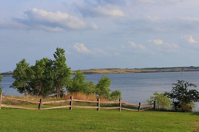 A shot of Kanopolis Lake on the north side of a wooden fence.