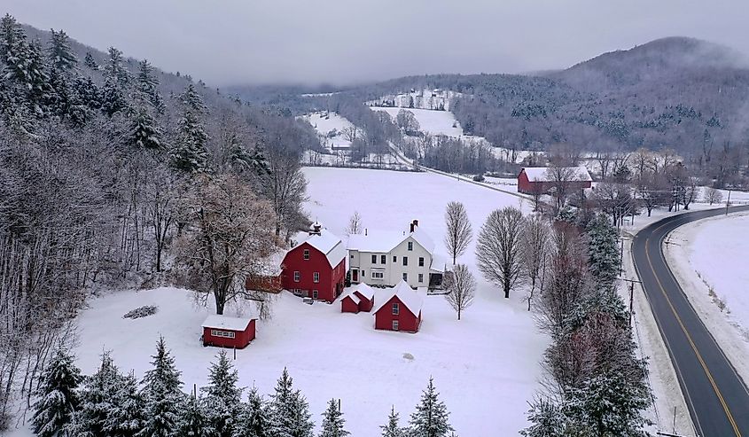 Rural farmhouse and barn in Brownsville, Vermont during the winter.