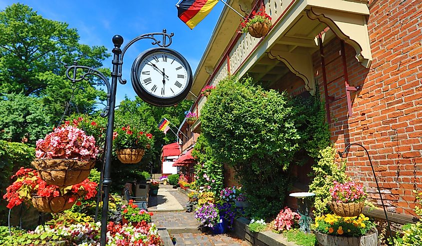 A clock and the stunning gardens in the German Village area of Columbus, Ohio