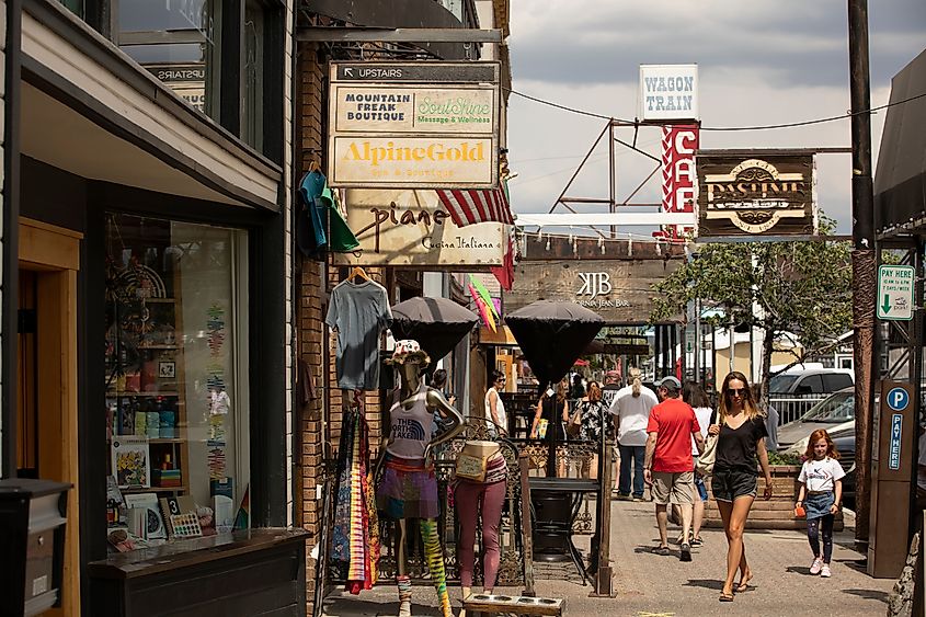 Pedestrians walk by historic downtown shops in Truckee, California
